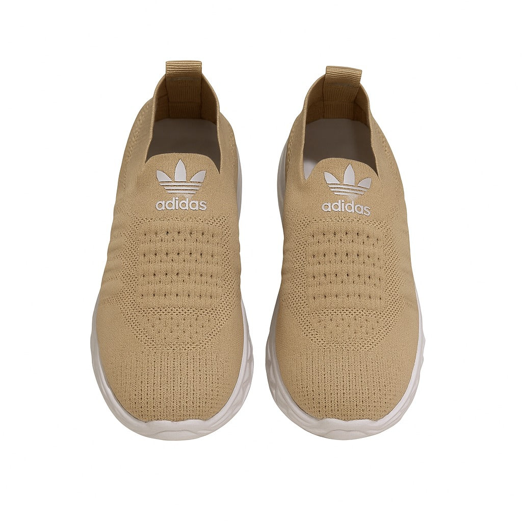 beige Adidas slip-on shoes with a white sole. 36883